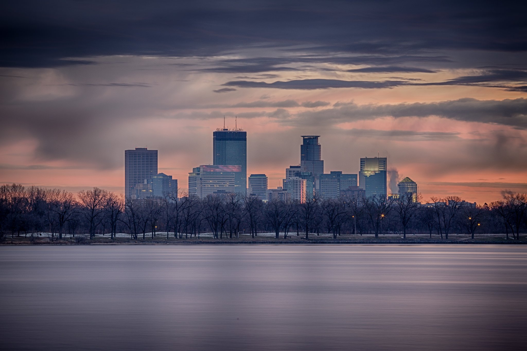 Sunrise over Lake of the Isles in Minneapolis, one of the free lakeside walking and biking paths on the city’s Chain of Lakes.